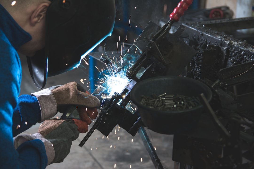 Welder hard work smoke sparks